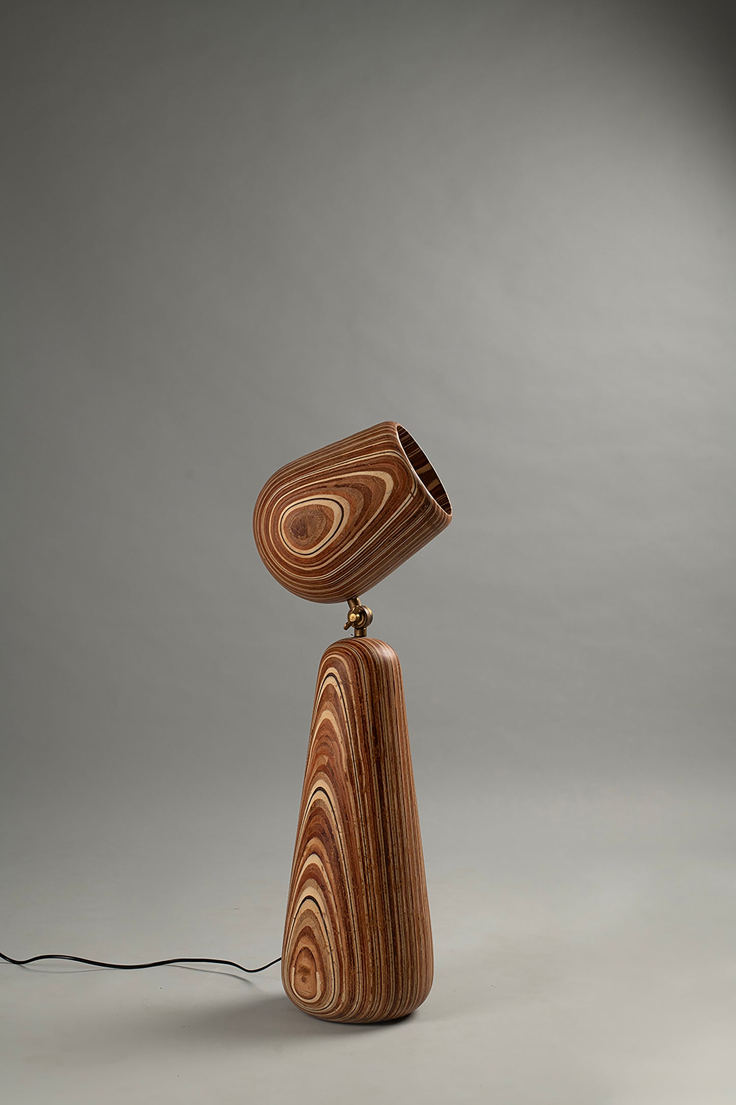 Wooden lamp with a unique design on a gray background