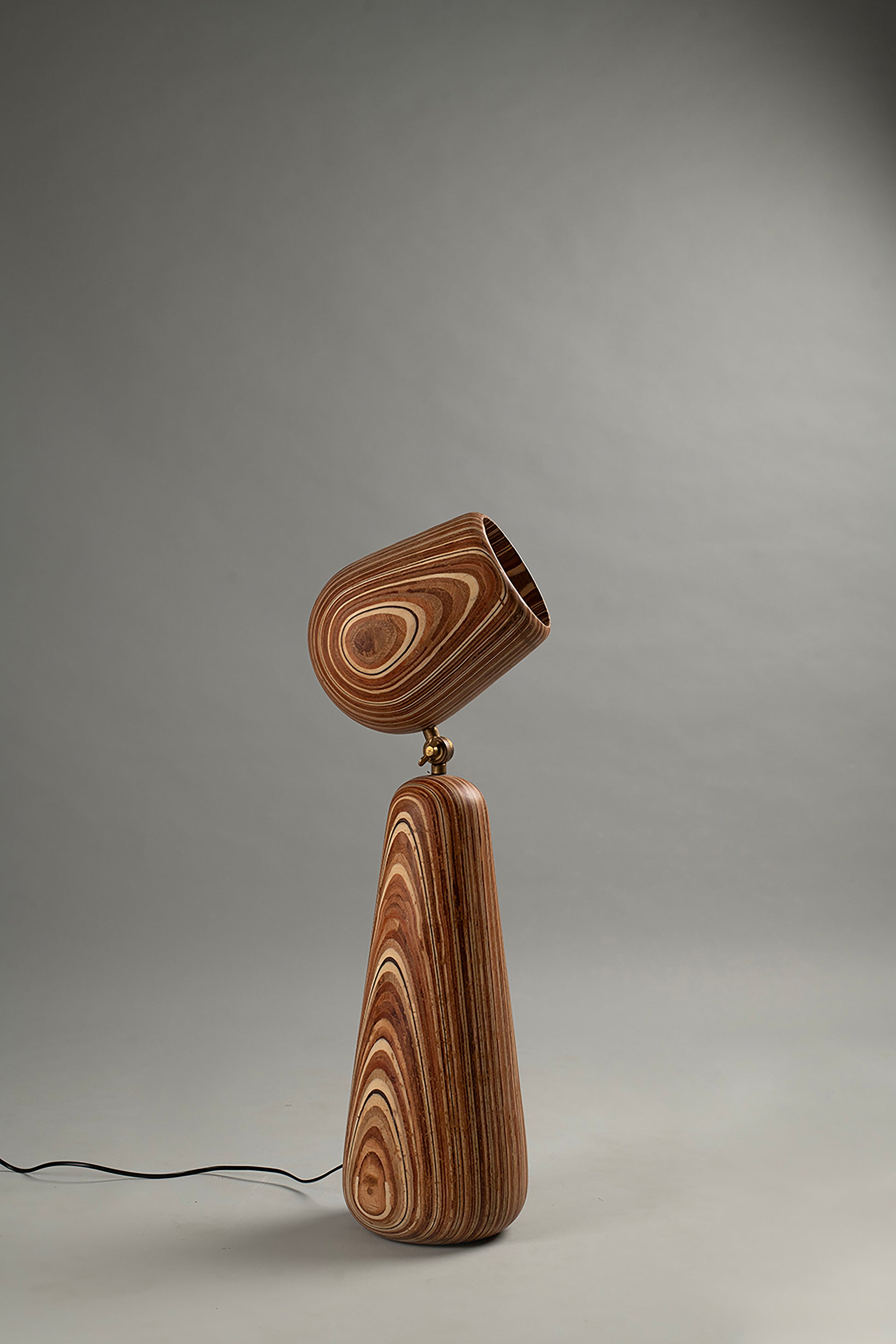 Wooden lamp with a unique design on a gray background