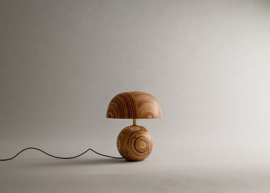 Wooden table lamp on a plain background